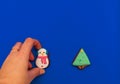 Christmas composition. Gingerbread cookies in the form of a snowman and a Christmas tree on a blue background. Flat lay, copy spac Royalty Free Stock Photo