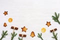 Christmas composition. Christmas gingerbread cookies, pine branches, and cinnamon sticks. New Year figure biscuits Royalty Free Stock Photo