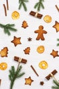 Christmas composition. Christmas gingerbread cookies, pine branches, and cinnamon sticks. New Year figure biscuits Royalty Free Stock Photo