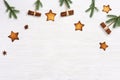 Christmas composition. Christmas gingerbread cookies stars, pine branches, and cinnamon sticks Royalty Free Stock Photo