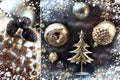 Christmas composition of gold decorations, golden trees, cones and sequins.