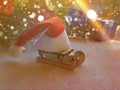 Christmas composition for greeting card. Wooden sled, Santa\'s red hat on the sled. Christmas New Year december time for