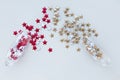 Christmas composition. Holiday composition. Champagne glasses with scattered red and gold stars of confetti on a white background