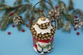 Christmas composition lantern snowman on the blue background of a winter spruce. Close-up. The concept of Christmas and New Year. Royalty Free Stock Photo
