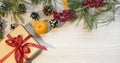 Christmas composition on a light background with gift boxes, with a red ribbon with fir branches, toys, copy space for your Royalty Free Stock Photo
