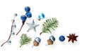 Christmas composition made of blue berries, silver star, baubles and green fir branch isolated on white background Royalty Free Stock Photo