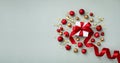 Christmas composition made of holiday ball and gift box with red ribbon in flat lay style. Creative greeting card Royalty Free Stock Photo