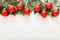 Christmas composition made of red bauble decorations, fir tree branches on white wooden table background. Christmas, Xmas, winter Royalty Free Stock Photo