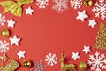 Christmas composition made of white snowflakes, tree, star, ball toy or bauble and deer on red background. New year winter concept Royalty Free Stock Photo