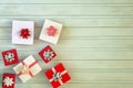 Christmas composition. Many small gift boxes decorated with bows. Place for text, copy space.