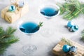 Christmas party composition with drinks gift boxes in blue color