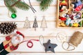 Christmas composition of New Year`s toys, fir branches and Santa Claus on a light table. View from above Royalty Free Stock Photo