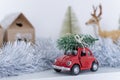 Christmas composition, New year - toy car with chtistmas tree on top Royalty Free Stock Photo