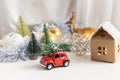 Christmas composition, New year - toy car with chtistmas tree on top Royalty Free Stock Photo