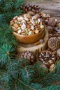 Christmas composition from nuts, tree branches, cones. mix of nuts. Royalty Free Stock Photo