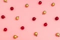 Christmas composition. Pattern of christmas red and gold balls on pink background. Trendy colors of christmas 2020. Flat lay, top Royalty Free Stock Photo