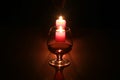 Christmas composition photo cognac glass and candle on black background Royalty Free Stock Photo