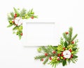 Christmas composition  with photo frame, cotton flower, branches of spruce and holly with red berries on white background. Merry Royalty Free Stock Photo