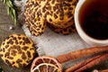 Christmas composition with pile of cookies, cinnamon and dried oranges on wooden background, close-up. Royalty Free Stock Photo