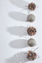 Christmas composition of pine cones and Christmas decorative balls on a white background. Christmas, winter, New year concept. Royalty Free Stock Photo