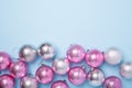 Christmas composition Pink and silver balls on pastel blue background. Christmas, winter, new year concept