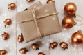 Christmas composition.Present box with twine and craft paper,golden acorns and balls Royalty Free Stock Photo