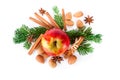 Christmas composition with red apple and winter spices on white top view Royalty Free Stock Photo