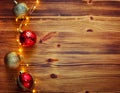 Christmas composition. Christmas red and gold decorations on a wooden background. Flat lay, top view, copy space Royalty Free Stock Photo