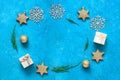 Christmas composition. Round frame of Christmas decorations on a blue grunge background. Top view, flat lay Royalty Free Stock Photo