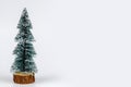 Christmas composition. small Christmas tree, and craft decorations on a white background. New Year concept.