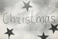 Christmas composition. Christmas text made with flour on black background