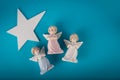 Three guardian angels and big white star Royalty Free Stock Photo