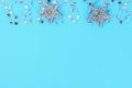 Christmas composition from Christmas tree toys. White decor on a blue background. Copy space, flat lay, top view. Royalty Free Stock Photo