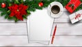 Christmas composition on white wooden table with blank piece peper for text
