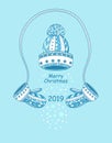 Christmas composition Winter hat with mittens snowflakes on light blue