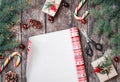 Christmas composition with xmas wrapping, Fir branches, gifts, pine cones, red decorations on wooden background Royalty Free Stock Photo