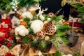 Christmas compositions and decorations made of fir branches, toys, balls, cotton, candle and deer figure at the fair Royalty Free Stock Photo