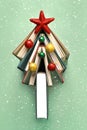 Christmas concept background. Books in the form of a christmas tree with christmas balls and red star Royalty Free Stock Photo