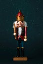 Christmas concept background. Top view of christmas wooden nutcracker toy solider and snowflakes