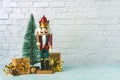 Christmas concept background. Christmas wooden nutcracker toy solider,christmas gifts boxes and christmas tree with space for text