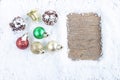 Christmas concept. Christmas decoration on snow with wooden back