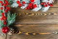 Christmas concept. Christmas fir tree with decoration on rustic vintage board. Pine branches. Fir cone. Snow on wood. Xmas and Hap Royalty Free Stock Photo
