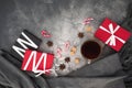 Christmas concept with coffee cup, candy, sugar and gifts on gray. Flat lay Royalty Free Stock Photo