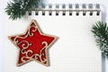 open blank spiral notepad with red wooden star christmas concept Royalty Free Stock Photo