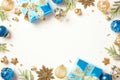 Christmas concept. Flat lay composition with blue and gold decorations, luxury gifts, confetti, fir branches isolated on white Royalty Free Stock Photo