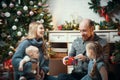 Christmas concept - happy family sitting near the tree and unpacking gifts Royalty Free Stock Photo