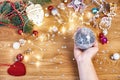 Christmas concept. Human hand hold a glass christmas bauble Royalty Free Stock Photo