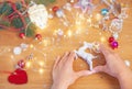 Christmas concept. Human hands hold a ceramic christmas decoration in a shape of deer Royalty Free Stock Photo