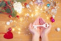 Christmas concept. Human hands hold a ceramic christmas decoration in a shape of key Royalty Free Stock Photo