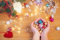 Christmas concept. Human hands hold a glass christmas baubles Royalty Free Stock Photo